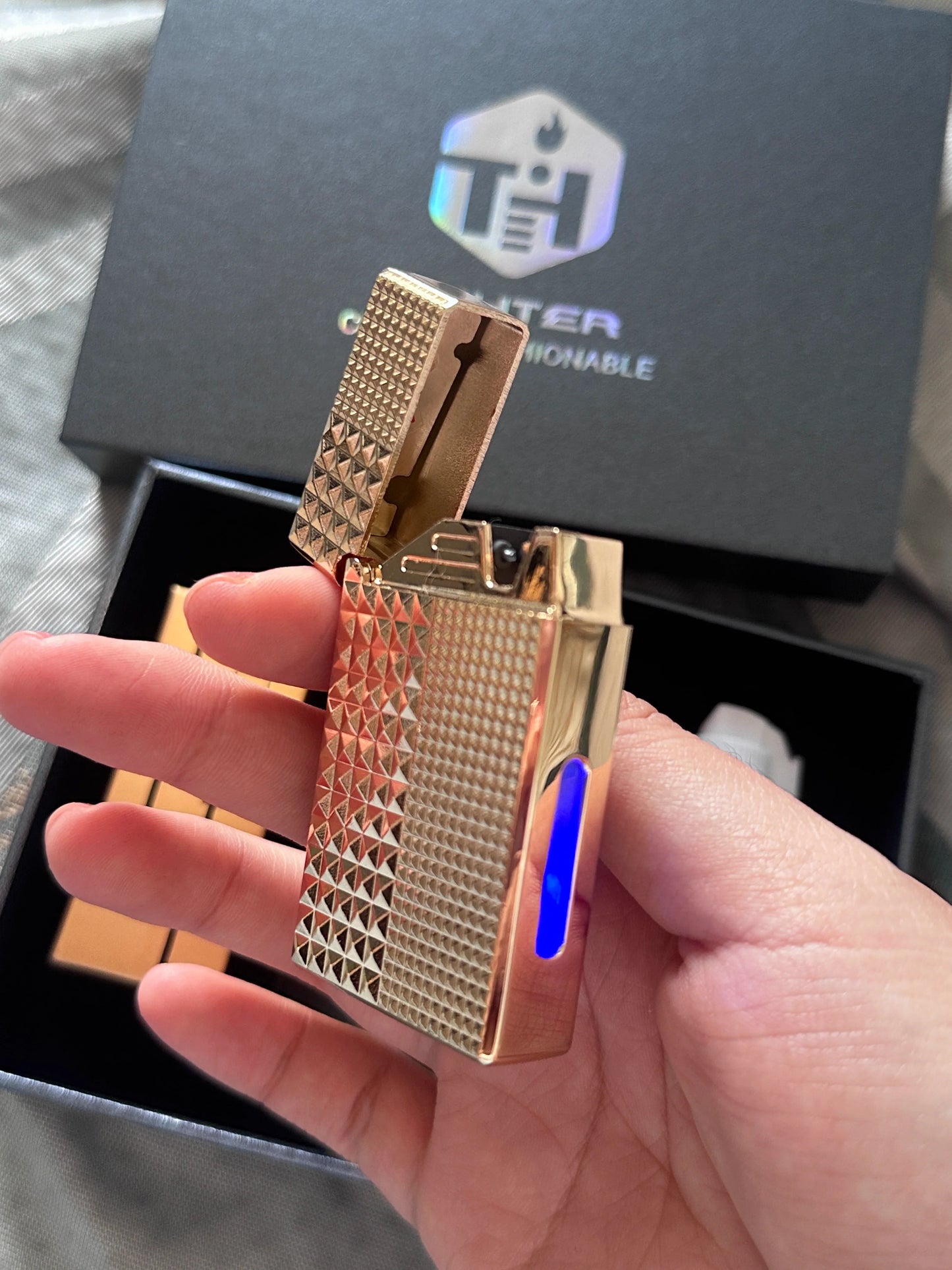A lighter with four intelligent ignition methods: voice control, air flow, gravity, and strike.